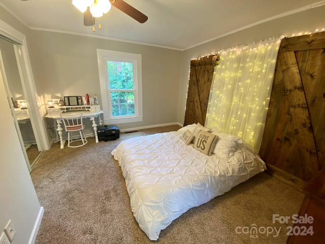 bedroom featuring ornamental molding, ceiling fan, and carpet floors