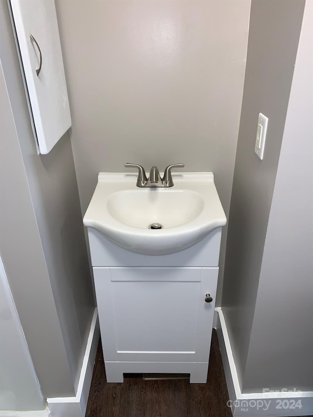 bathroom featuring vanity and hardwood / wood-style flooring