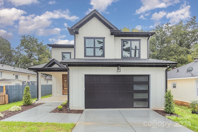 2305 Sanders Ave, Charlotte, NC 28216 - modern inspired farmhouse featuring board and batten siding, concrete driveway, a garage, and fence