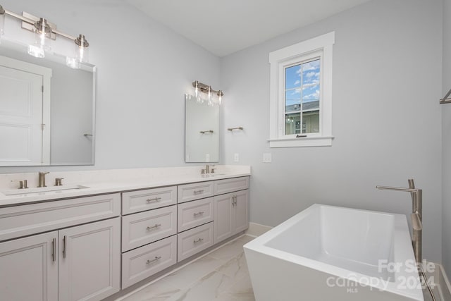2305 Sanders Ave, Charlotte, NC 28216 - full bathroom featuring marble finish floor, a sink, double vanity, and a freestanding bath