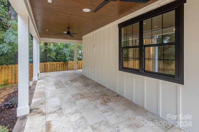 2305 Sanders Ave, Charlotte, NC 28216 - view of patio featuring ceiling fan and fence