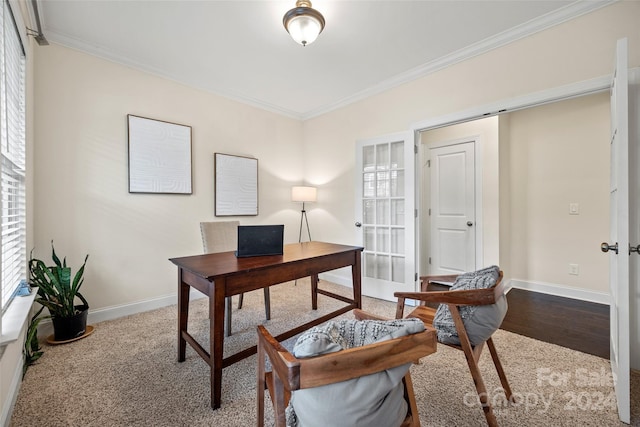 home office featuring a healthy amount of sunlight, crown molding, and hardwood / wood-style floors