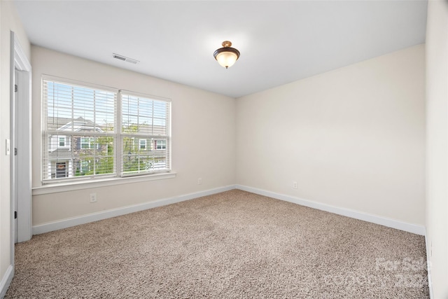 unfurnished room with carpet flooring