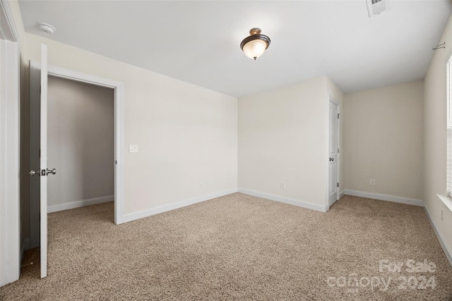 unfurnished room with carpet flooring