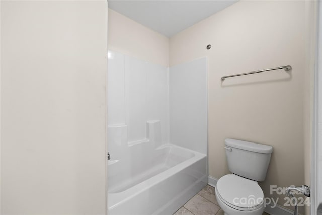 bathroom featuring tile patterned flooring,  shower combination, and toilet