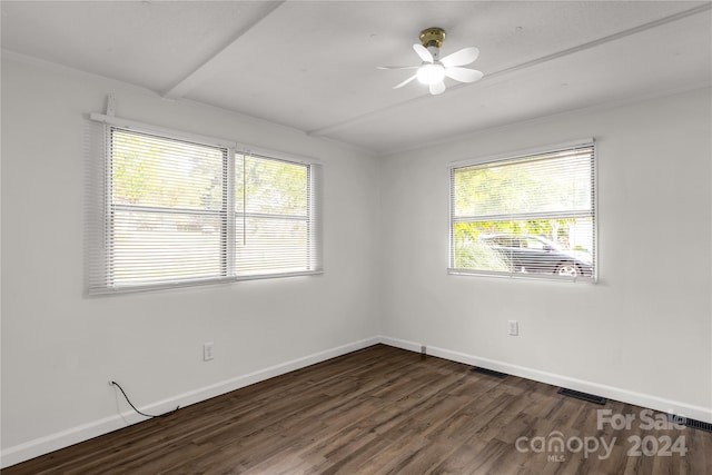 unfurnished room featuring ceiling fan and dark wood-type flooring