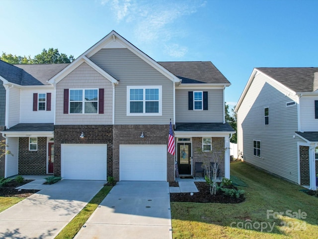 view of front facade with a front yard and a garage