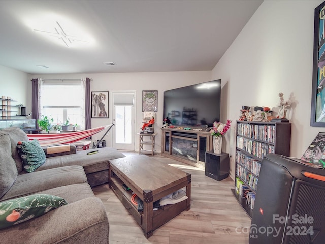 living room with light hardwood / wood-style floors