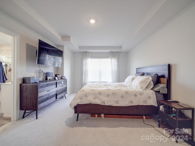 bedroom featuring light colored carpet