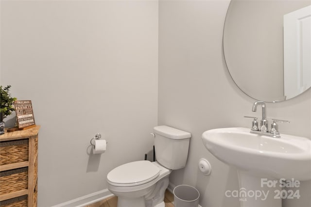 bathroom with sink and toilet