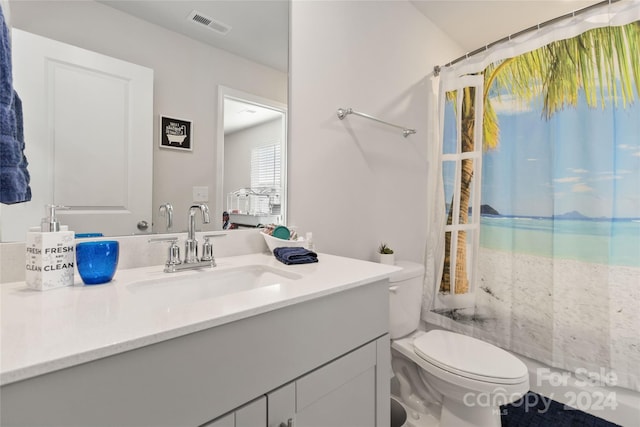 bathroom with a shower with curtain, vanity, and toilet