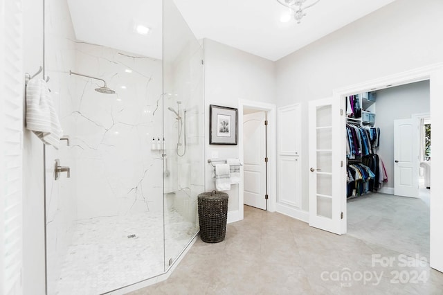 bathroom with a tile shower