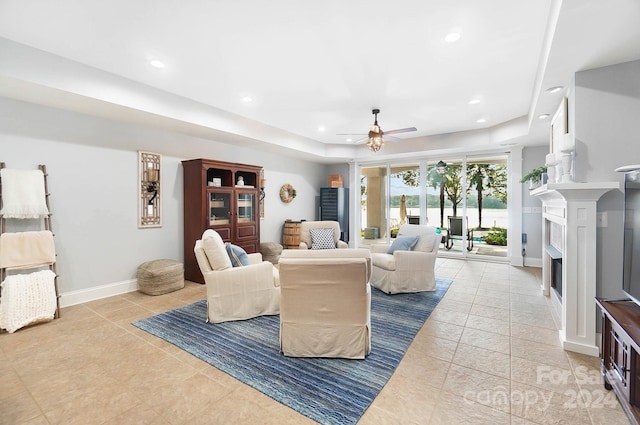 living room featuring ceiling fan and light tile patterned floors