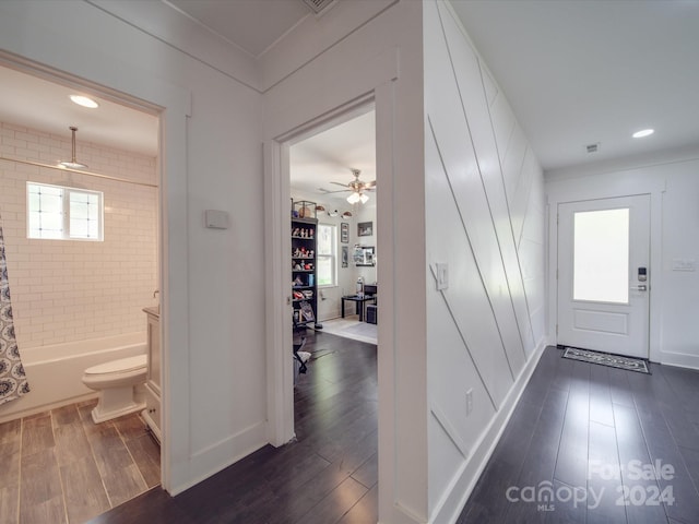 foyer entrance featuring ceiling fan and dark hardwood / wood-style flooring