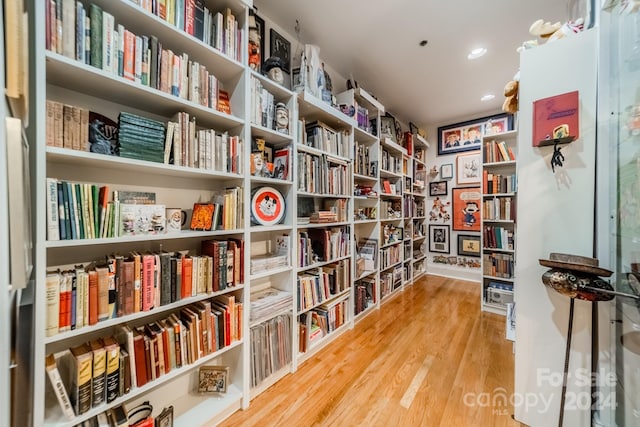 sitting room with hardwood / wood-style flooring