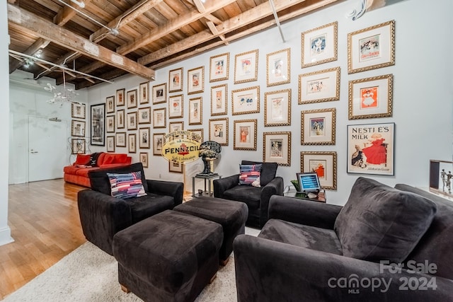 interior space featuring wood ceiling, wood-type flooring, and beam ceiling