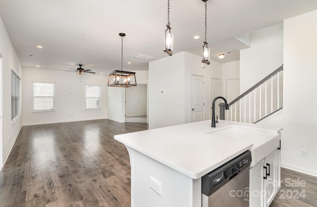 kitchen with dishwasher, a kitchen island with sink, decorative light fixtures, white cabinetry, and dark hardwood / wood-style flooring