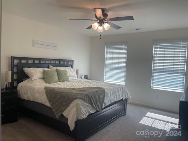 carpeted bedroom with ceiling fan