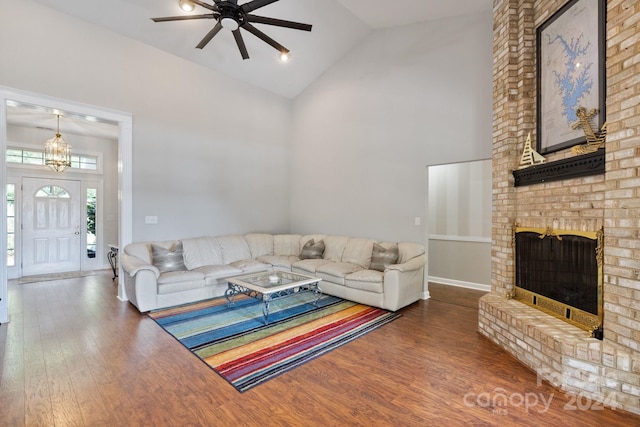 living room with wood-type flooring, high vaulted ceiling, and ceiling fan