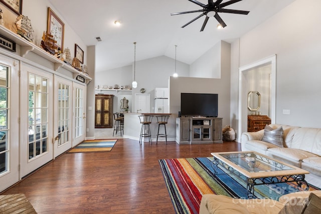 living room with ceiling fan, dark hardwood / wood-style floors, and high vaulted ceiling