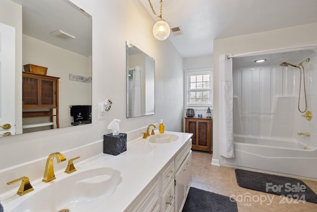 bathroom featuring shower / bathtub combination with curtain, tile patterned floors, and vanity