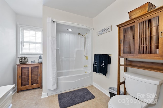 full bathroom featuring tile patterned flooring, shower / bath combo, vanity, and toilet