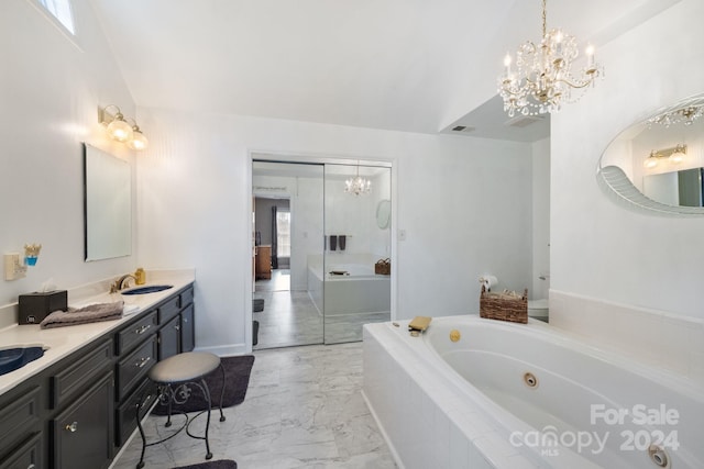 bathroom featuring tiled bath and vanity