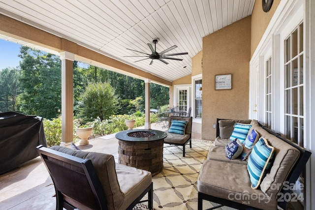 view of patio / terrace featuring ceiling fan, grilling area, and an outdoor living space with a fire pit