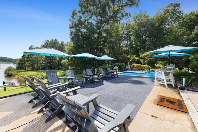 view of patio featuring a water view