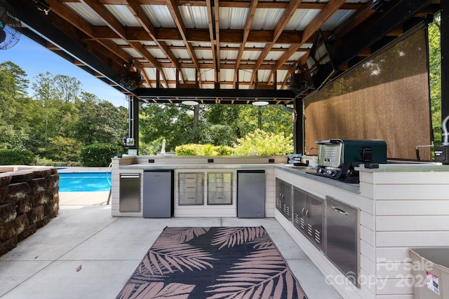 view of patio featuring exterior kitchen