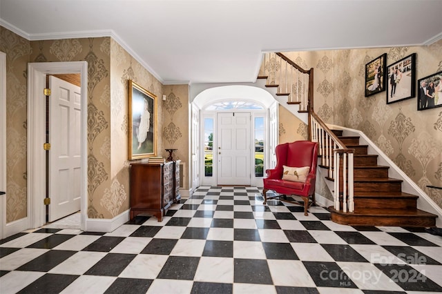 entrance foyer featuring ornamental molding