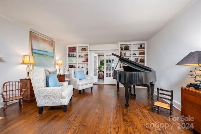 sitting room with ornamental molding and hardwood / wood-style flooring