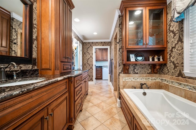 bathroom featuring vanity, crown molding, tile patterned floors, and a bathing tub