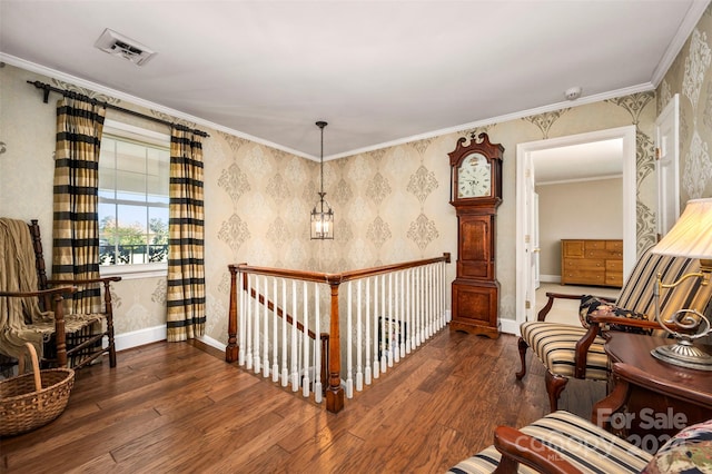 living area with ornamental molding and dark hardwood / wood-style floors