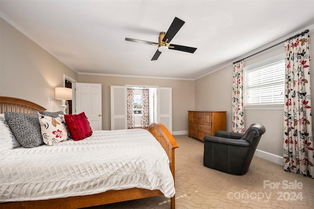 bedroom with crown molding, multiple windows, light colored carpet, and ceiling fan