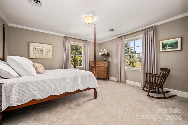 carpeted bedroom with ornamental molding