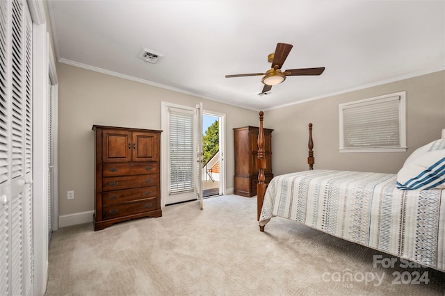 bedroom with access to exterior, a closet, light carpet, ornamental molding, and ceiling fan