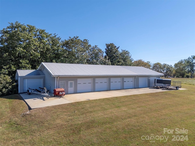 garage with a yard