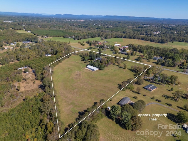 birds eye view of property featuring a rural view