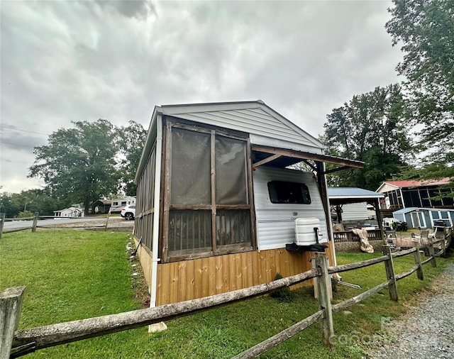 view of outdoor structure featuring a yard