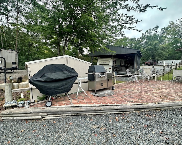 wooden deck featuring a patio and grilling area