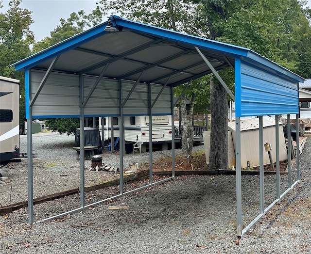 view of vehicle parking featuring a carport