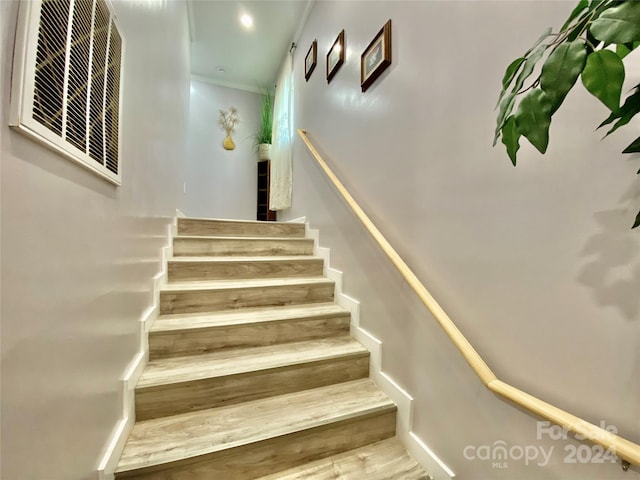 stairs with wood-type flooring