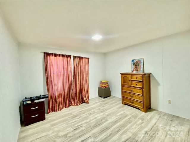 bedroom with light hardwood / wood-style flooring