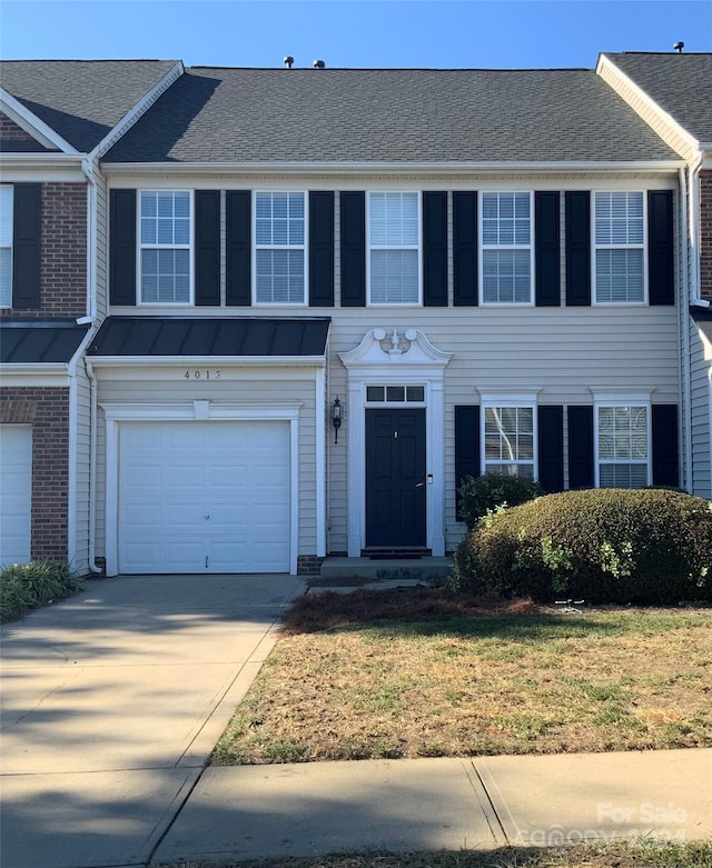 townhome / multi-family property featuring a garage