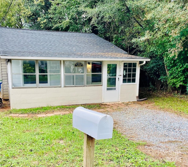 view of outbuilding featuring a yard