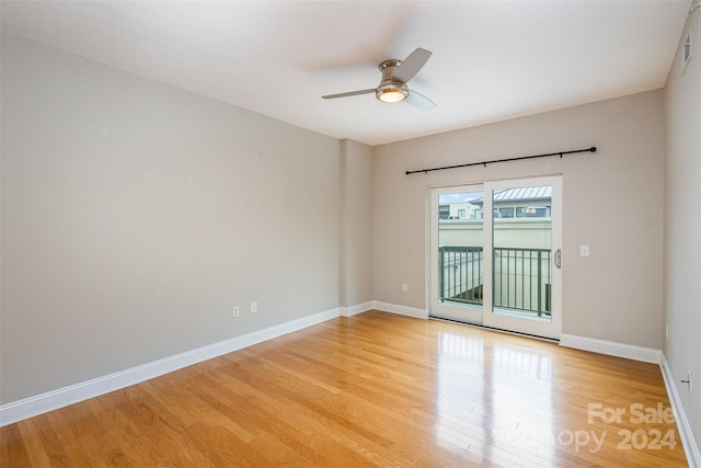 unfurnished room with ceiling fan and light wood-type flooring