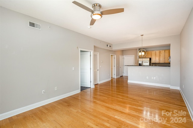 unfurnished living room with light hardwood / wood-style floors and ceiling fan