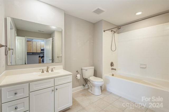 full bathroom with tile patterned flooring, vanity, toilet, and tiled shower / bath