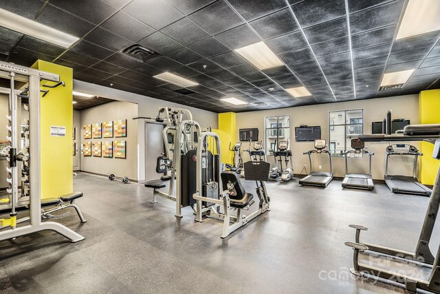 gym with a drop ceiling